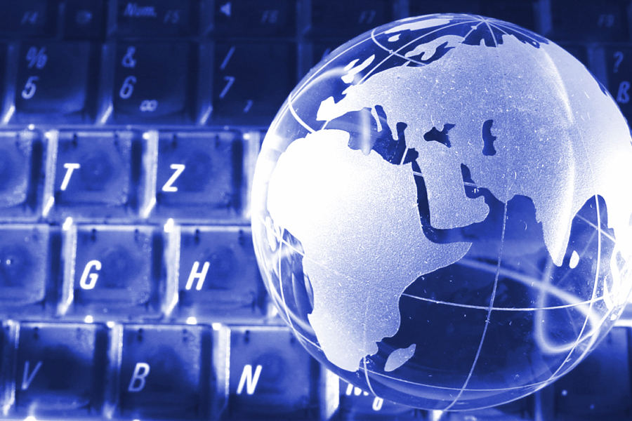 Image: Computer keyboard with globe in the background Image: Computer keyboard with globe in the background