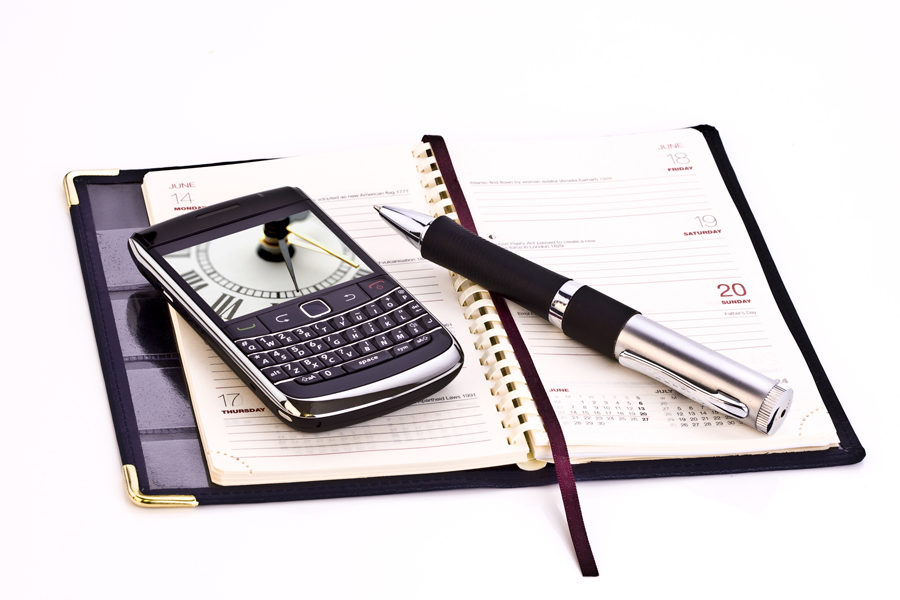 Bild: Terminkalender mit Bild und Mobiltelefon Bild: Terminkalender mit Bild und Mobiltelefon