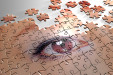 Bild: unfertiges Puzzle eines Auges